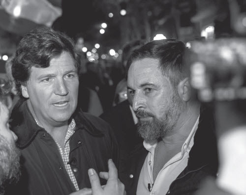 Former Fox News host Tucker Carlson and Vox president Santiago Abascal attend a protest against a plan to grant amnesty to Catalan separatists, in Madrid, November 13, 2023. (VOX ESPAÑA / CC0)
