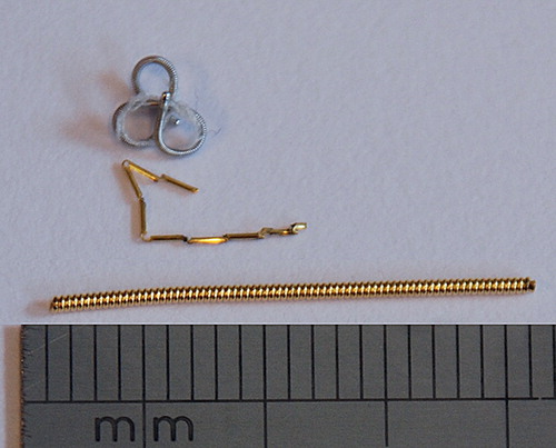 Figure 1. Photo showing the complex helical platinum marker (top), the Gold AnchorTM marker (middle) and the VisicoilTM gold marker (bottom).