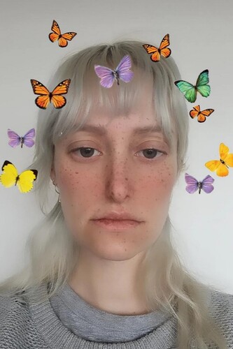 FIGURE 3. Surgery filter ‘butterfly’ by @ilovediany. The filter significantly alters the nose and lips, in addition to ambient makeup and freckles. The crown of static AR butterflies is part of the femininising play found in many Glamourising filters.