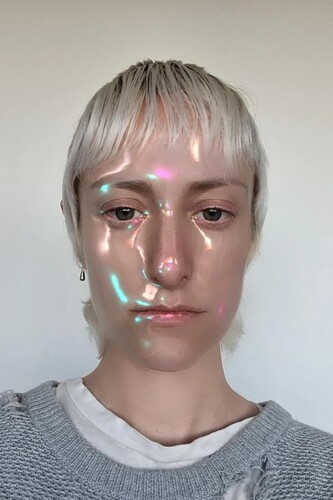 FIGURE. 6 Cyborgian filter ‘Beauty3000’ by @johwska. The filter applies an iridescent, semi-opaque sheen to the user’s skin, effecting a human/ machine aesthetic.