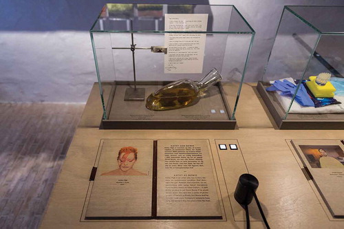Figure 4. The work of artist Kathy High as featured in the exhibition. In the display case is a copy of the letter she wrote to David Bowie, as well as a glass vessel containing ceramic stool in honey, from her series The Bank of Abject Objects. The audience can also listen to an interview with High about her work. Copyright Medical Museion.