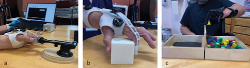 Figure 3. Test apparatuses used to acquire metrics of hand biomechanics and upper extremity function including: (a) maximum pincer force; (b) pincer aperture; and (c) box and block test.