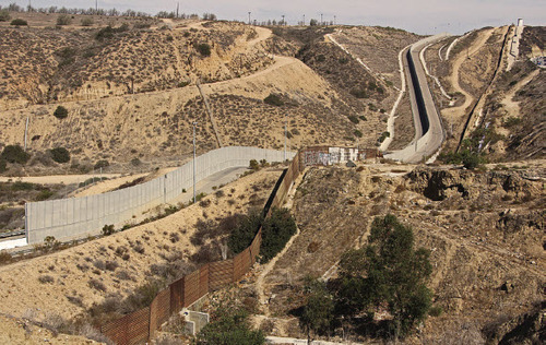 Figure 5: Tijuana, Mexico, 2014 One section of the wall between Tijuana, Mexico and the United States is currently a double-layer structure—the first section of the barrier was built in the mid-1990s and consists of 14 miles of welded steel. In the early 2000s, a secondary, 14 to 18-foot high structure was added 130 feet north of the first.