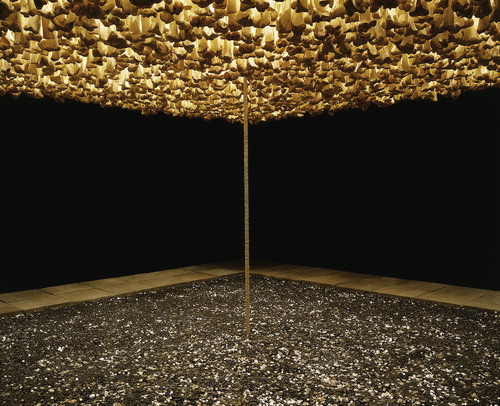 Figure 1 Cildo Meireles. Missão/Missões (Como construir catedrais) [Mission/Missions (How to Build Cathedrals)], 1987. Media: 600,000 coins, 800 communion wafers, 2,000 cattle bones, 80 paving stones, and black cloth. Height: 235 cm, 36 m2. 81 × 54 mm. Photo: Zoe Tempest. Courtesy of Daros Latin America Collection – Zurich.