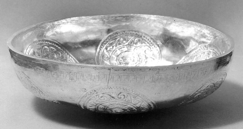 Figure 32. Bowl with medallion decorations. Silver. Dimensions: H. 2 1/4 × W. 8 × D. 7 3/4 in. (5.7 × 20.3 × 19.7 cm). The Metropolitan Museum of Art, New York; The Michael C. Rockefeller Memorial Collection, Gift of Nelson A. Rockefeller, 1969 (Accession Number: 1978.412.220).