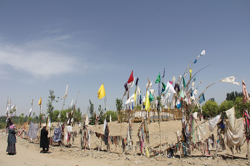 Figure 1. Worshippers at the shrine of Imam Aptah, near Khotan. Courtesy of Rahile Dawut.