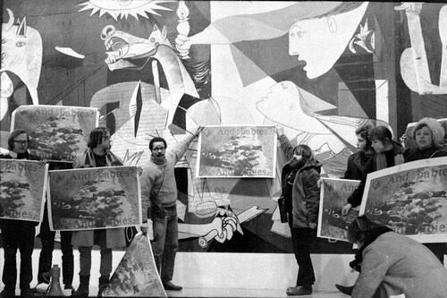 Figure 1 Jan van Raay, Art Workers’ Coalition and the Guerilla Art Action Group protest in Front of Picasso’s “Guernica” at the Museum of Modern Art, with the AWC’s “And Babies?” poster, 1970. Photograph, Museum of Modern Art, New York © Jan van Raay/Succession Picasso/DACS, London 2022.
