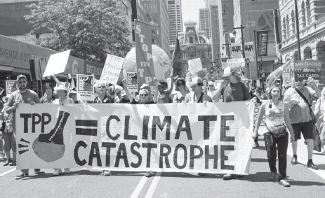 Fig 2 Protestors at the March for Clean Energy in Philadelphia oppose the ratiﬁcation of the Trans-Paciﬁc Partnership in July 2016. PAUL BECKER / CREATIVE COMMONS