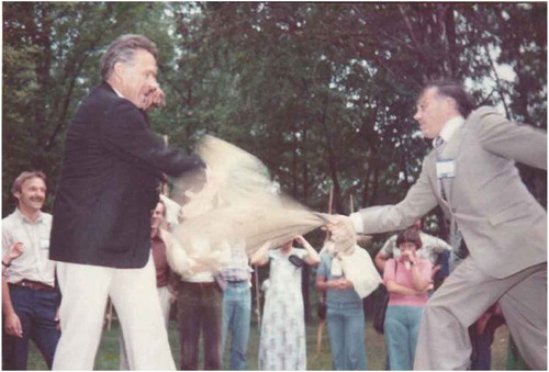 Figure 3. Fritz Ackerman and Gottfried Konecny in a fun fight during the ISP congress in Helsinki in 1976 when they tried to push each other from a balancing bar with a straw bag