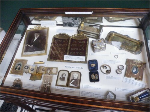 Figure 2. Family and Friends Display Case at the Salomons Museum, including a fragment of the Kotel given to the family by David Roberts, and the postcard referring to David Lionel's gift to Vera. Reproduced with the permission of Salomons Museum.