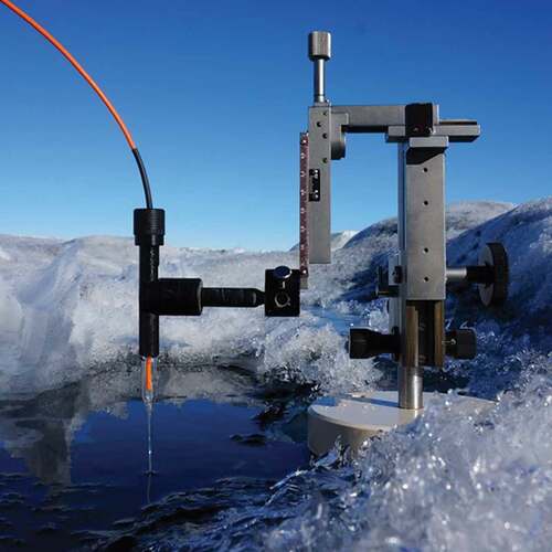 Figure 3. Microoptode positioned with a manual micromanipulator for in situ measurement of an oxygen profile in a cryoconite hole on the surface of the Greenland Ice Sheet