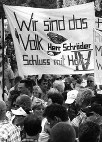 Figure 1. Demonstrators in Magdeburg using the Wir sind das Volk (We are the people) to demand that Chancellor Schröder end the Hartz-IV reforms (Source: Der Spiegel, 10.08.2004).