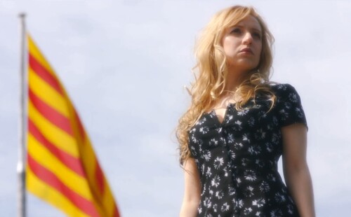Figure 7. Catalina (Nat Portnoy) is dramatically introduced against the backdrop of the Catalan flag.