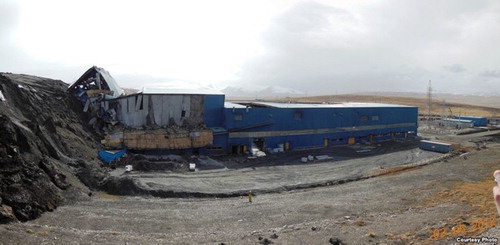 Figure 3. Mine infrastructure being bulldozed by permafrost creep below the Davidov Glacier mine dump in April 2013 (Bruce Pannier's Qishloq Ovozi blog).