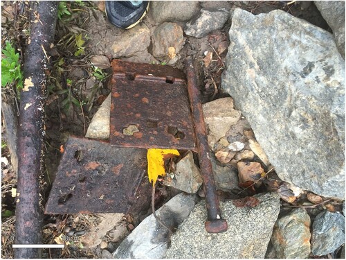 Figure 8. Iron rail ties and spikes observed on a mid-channel cobble/gravel bar in Piney Branch Creek.