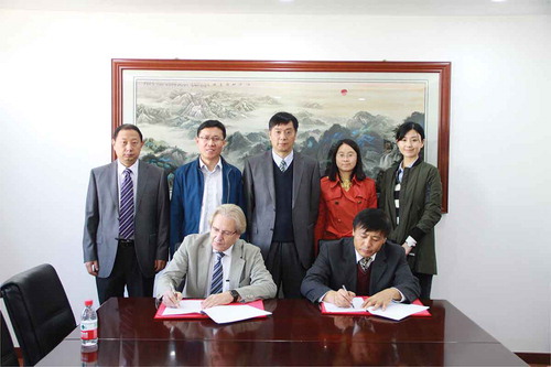 Figure 1. Signing of the cooperation agreement between LASAC and the University of Vienna by Q. Wang (LASAC) and W. Kainz (University of Vienna) (Source: LASAC)