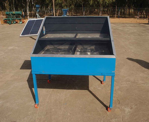 Figure 3. PVT hybrid solar dryer installed at CAZRI solar yard.