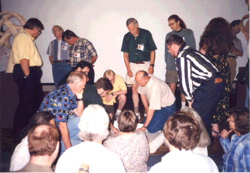 Figure 3. This photograph, taken by Carlo Séquin in 1999 at the Bridges Conference in Winfield, Kansas, remained one of Reza's favourites because it lent itself to an interpretation of Raphael's painting, School of Athens (1510), with artists, mathematicians, and scientists conferring. Photo, courtesy Carlo Séquin.