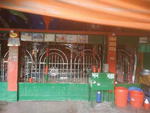 Image 1. The teen-shaded shrine of Haidar Baba at the north-east corner of the local cemetery of Mohammadpur Photo Credit: Surveyor.