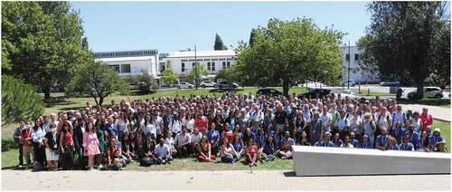 Figure 1. Conference attendees posing for a group photo under Portugal’s blue skies. Image adapted from https://ilcc2022.org/fotos/.