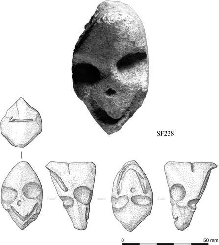 Figure 10 A double-faced head, carved in stone SF238 (photos: S. Mithen and B. Finlayson).