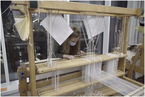 Figure 2. A student explores different parts of the loom. Image: Luis Vega.