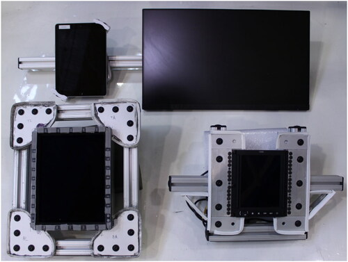 Figure 4. The four touchscreens used in this study, within the frames used to attach them to the vibration platform. From top left to bottom right: iPad, Planar touch monitor, avionic MFD, and avionic MCDU.