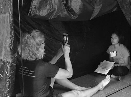 Figure 2 GoCheck Kids iPhone 7 Plus with flash-concentrating case being used in a tent in Burma.