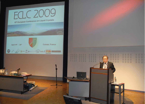 Figure 1. Daniel Guillon opening the 2009 European Conference on Liquid Crystals.