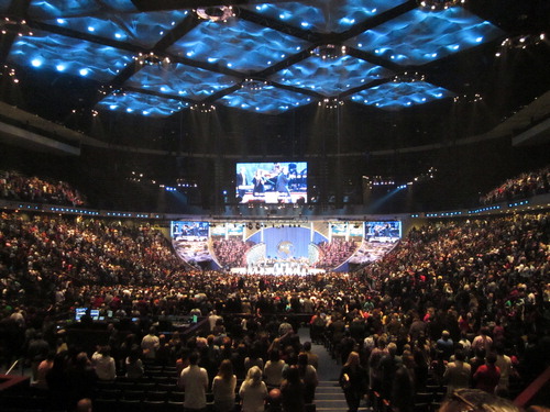FIG 3 Lakewood Church auditorium in default light mode with stage and colour cloud ceiling in sky-blue. Photo by the author, 2012.