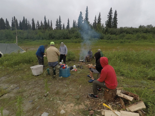 Figure 6. Elders, on-the-land experts and youth sharing a meal together. (Photo credit: Participant 34).