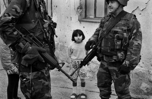 Figure 2. Tom Stoddart photograph titled ‘Bosnia, Sarajevo, Girl (4–5) standing near US soldiers in street’ (with permission from Getty Images).