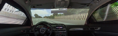 Figure 4. Vehicle-in-the-loop system. Participants drive a real car that is fitted with screens on which a simulated environment is projected.