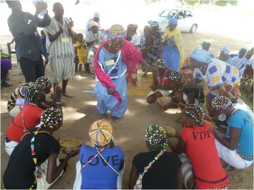 Figure 5. Girls and grandmothers collaborate to promote positive cultural values and adolescent health and well-being, Sare Samba Nety, Senegal. Photo credit: Judi Aubel.