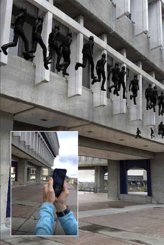 Figure 8. AR image targets can be positioned anywhere, as long as their position in the real world matches their location in the virtual environment. In this instance, the image position on the outside of the building allows for the visual analysis of human movement within it. (Main) A screenshot of virtual evacuees superimposed on the real world. (Inset) The author using the AR application.