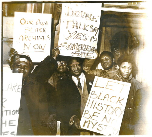 Figure 2. One black and white photograph of supporters, picketing Lambeth Town Hall for use of the Somerleyton Road site by Black Cultural Archives, which includes Len Garrison. BCA ref: BCA/4/1/1/4.