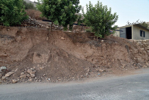 Fig. 5. Koubba II—Archaeological deposits exposed by road-cutting.