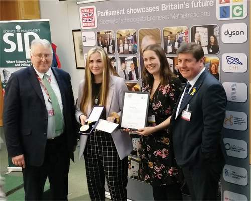 Figure 3. Adele Parry (second from the left) receiving the Henry Cavendish gold medal in physics and the overall Westminster Medal for her work on liquid crystal droplet biosensors at STEM for Britain 2022.