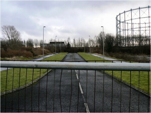 Figure 5: One of several new roads constructed just before the financial crisis to access housing which was never built. It ends abruptly where it hits the northern boundary wall of the former Gasworks (the road was built by WEL; the wall was owned by British Gas). The land on the left is now occupied by the Social Bite Village, an innovative charity project that provides ‘tiny houses’ for homeless people. Source: author 2015.