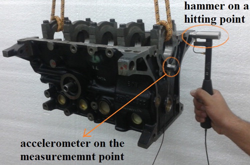 Figure 2. Upside down engine cylinder block during experimental modal analysis.