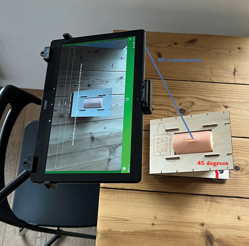 Figure 1. Research setup with a Lenovo P10 tablet in a stand and a simulator by PediatrickBoxx.