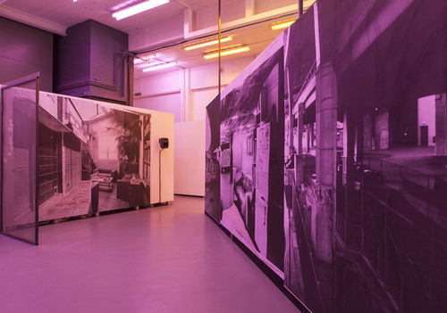 Figure 2. Ford’s “Alpha, Isis, Eden,” installed at The Showroom gallery in London recreating the zine page as an immersive environment with barrier fencing, jarring walls, and advertisement reproductions defaced by anarchically scrawled narratives while speakers play her new sound work.