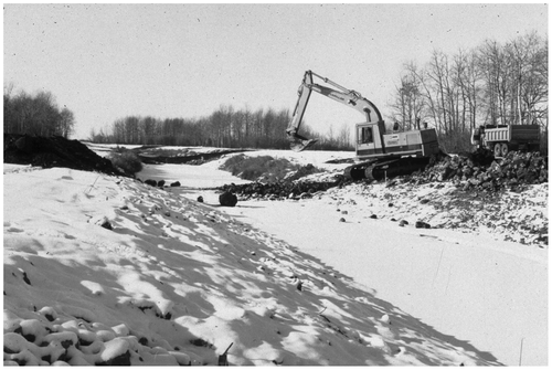 Figure 16 Mink Creek riffles constructed in the winter of 1985/86. Fieldstone was gathered from nearby farms that had been set aside as the land was prepared for cultivation. Sand and shale gravels from the bed of the stream were used to infill the interstitial spaces.