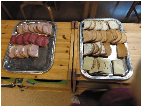 Photo 1. Open end sandwiches. The tray to the left contains two kinds of pork-based sausages, as well as liver pâté, a cheap and common spread in Norway. The tray to the right contains different kinds of spreadable cheese (white and brown), as well as slices of white and brown cheese. All common spreads in Norway.
