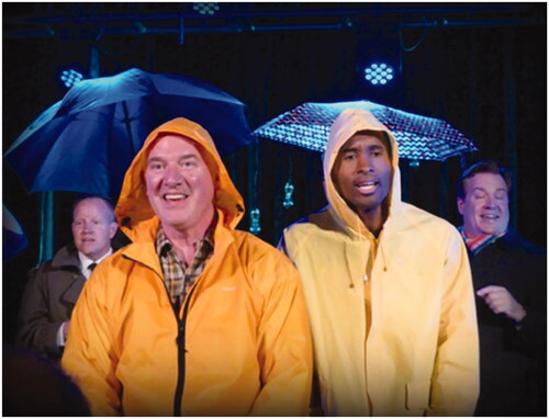 Figure 5 DMGMC members performing in raincoats with umbrellas. Courtesy of the DMGMC.