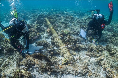 Figure 9. Irini Malliaros (SWF) and James Hunter (ANMM) recording the anchor on the reef top (A2) (photo: Julia Sumerling).