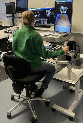 Figure 1. A resident interacting with the transvaginal ultrasound simulator.