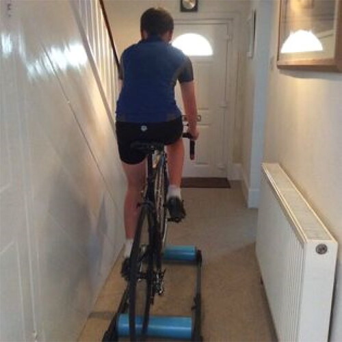 Figure 4. Tom riding a bike on rollers in the hallway.Source: Authors.