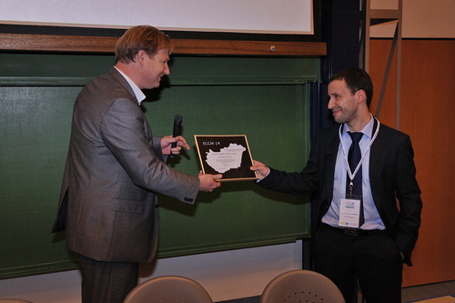 ESCM President, Prof. Leif Asp, presents ESCM Award to Dr Silvestre Pinho from Imperial College, London