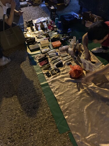 Figure 2. A man arranges cosmetics and other items in his stall at Pei Ho Market (PHM).Source: Author, 2019.